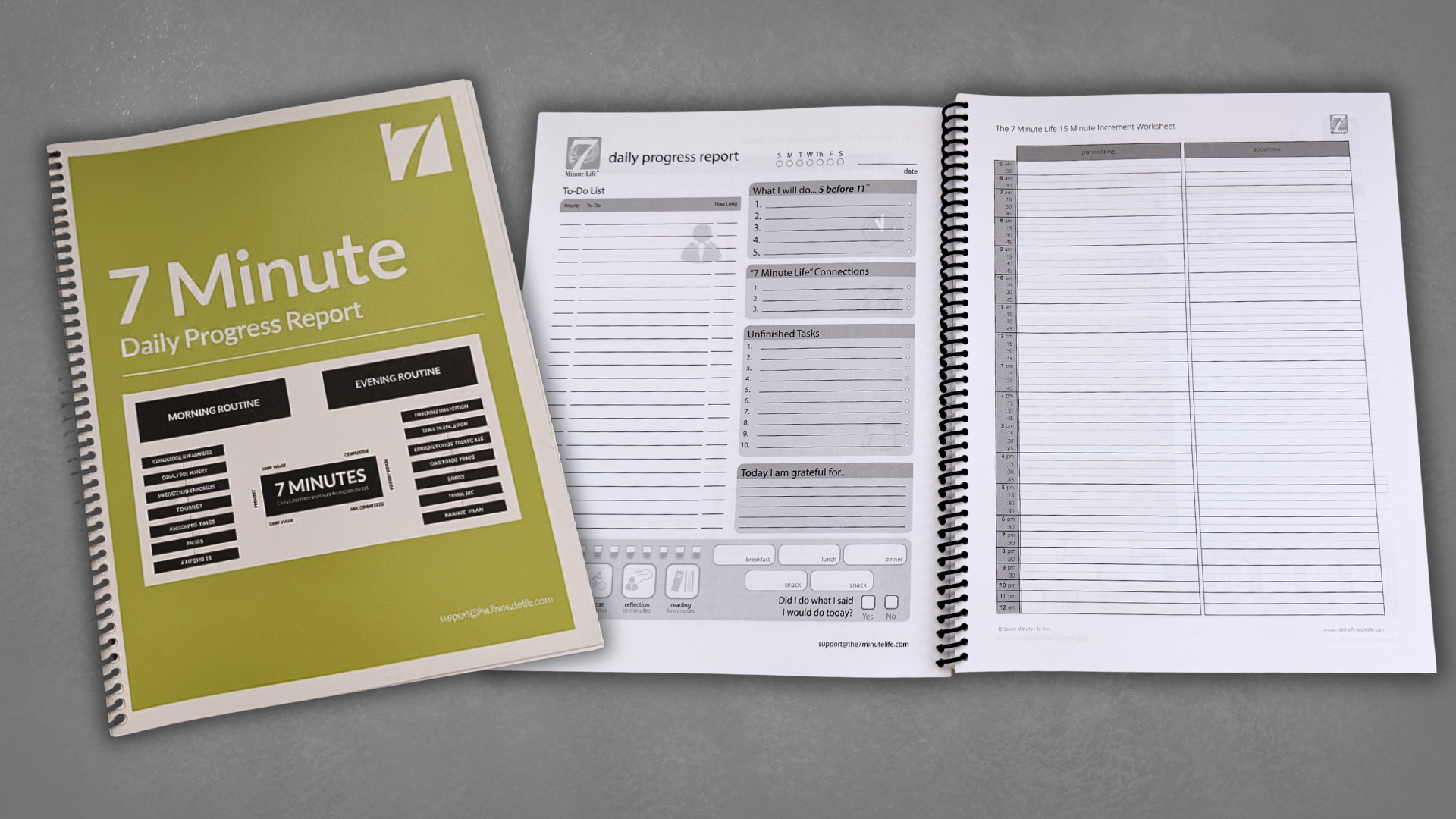 The 7 Minute Life Daily Progress Report workbook, open to show the daily progress report and 15-minute increment worksheet pages